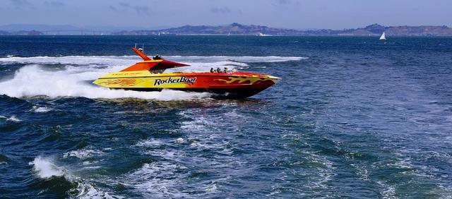 A speedboat travels 70 miles in 3.5 hours. Calculate the speed of the boat.