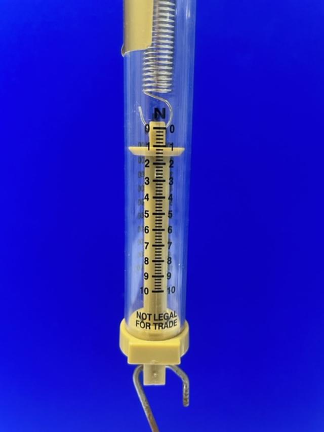 The image shows a newton meter which has a spring inside it. Why is a spring used in the newton meter?