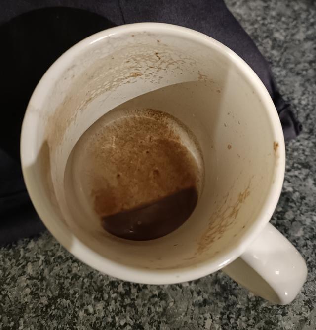 A cup with some hot tea is left in a cold room. The image shows you what it looks like after a day or so. What has happened?