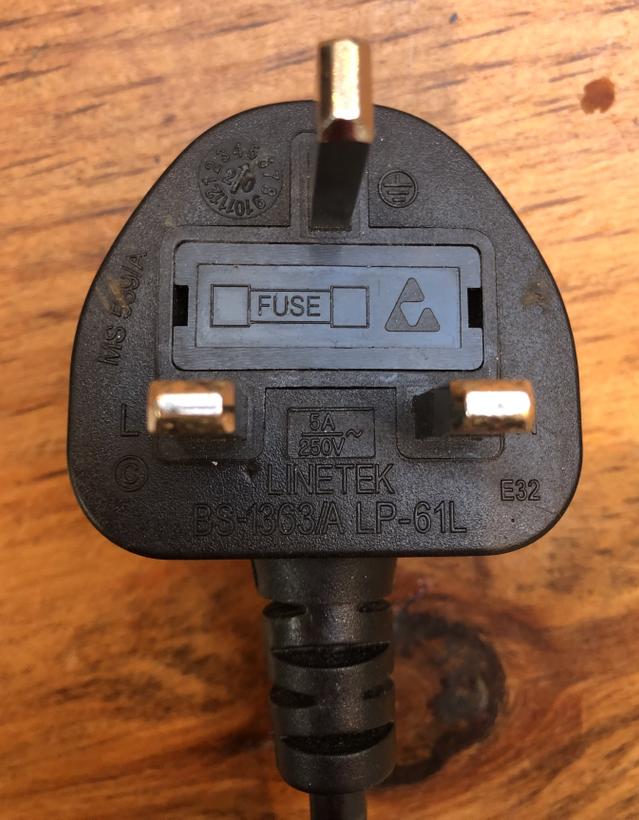 How does the plastic casing on electrical plugs protect us?