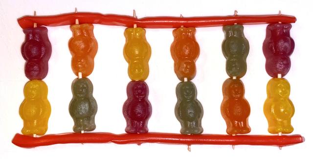 The photograph shows a model of part of a DNA molecule. It is made from liquorice and jelly babies. What would improve the model?