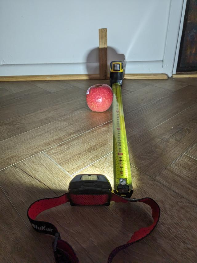 What happens to an object's shadow when the object moves further away from a light source?