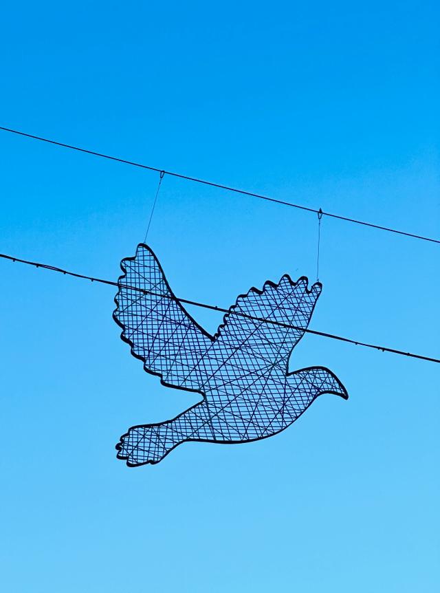 A sculpture is different from a painting because it can be seen from __________ sides.
